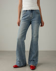Jeans a zampa in denim slavato