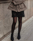 Minigonna in tweed con pizzo