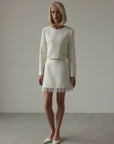 Completo in tweed con frange di perle