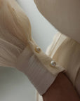 Blouse à délicats détails en dentelle