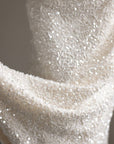 Weißer Strickpullover mit Perlendetails