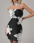 Minivestido negro con flores aplicadas