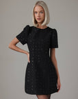Miniabito nero con paillettes