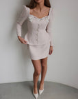 Vestido peplum de bouclé con perlas