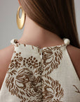 Robe beige élégante brodée à col licou
