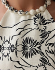 Robe longue beige drapée à col licou