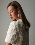 Blouse blanche texturée ornée à manches courtes