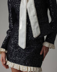 Conjunto negro de lentejuelas con encaje crema