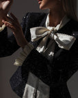 Conjunto negro de lentejuelas con encaje crema