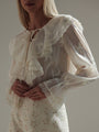 Blusa de encaje con volantes