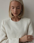 Completo in tweed con frange di perle