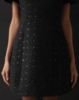 Miniabito nero con paillettes