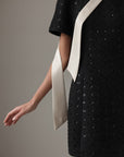 Miniabito nero con paillettes