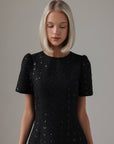 Miniabito nero con paillettes