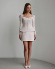 Vestido peplum de bouclé con perlas