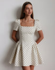 Miniabito bianco a pois stile vintage