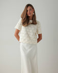 Blouse blanche texturée ornée à manches courtes