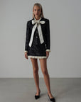 Conjunto negro de lentejuelas con encaje crema