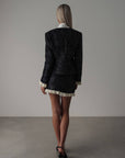 Conjunto negro de lentejuelas con encaje crema