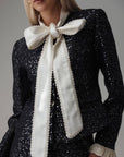 Conjunto negro de lentejuelas con encaje crema