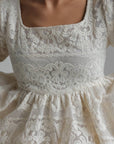 Completo top peplum e gonna in pizzo avorio